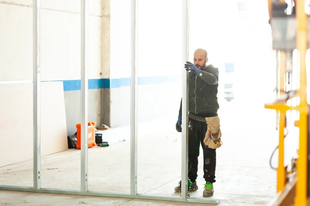 Man installing aluminium for a building facade